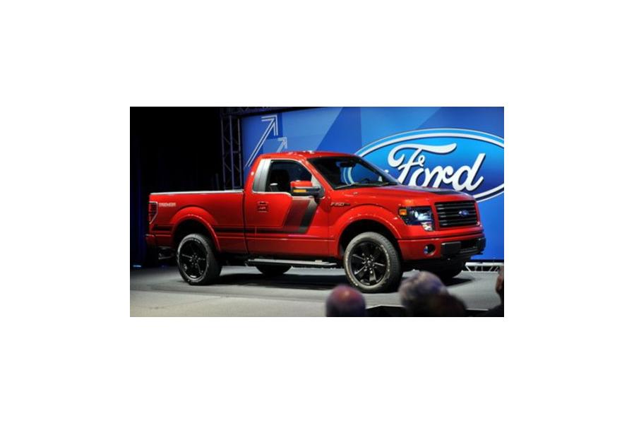 Ford's profit plummets by almost half, cuts 2018 outlook