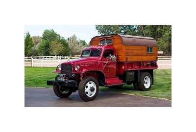 A solid oak camper now sits on the back. There's enough room to sleep and a small kitchenette inside.