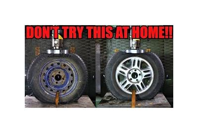 Here's What Happens When You Crush Steel and Alloy Wheels With a Hydraulic Press