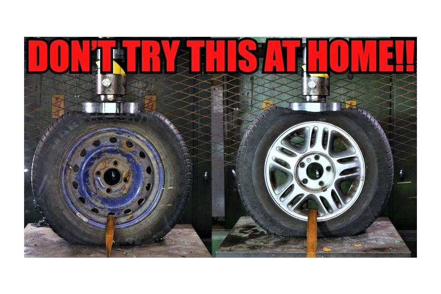 Here's What Happens When You Crush Steel and Alloy Wheels With a Hydraulic Press