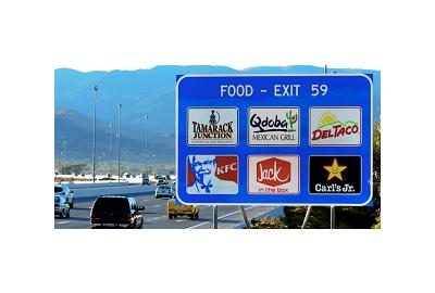 Here's How Much Businesses Pay To Get On Those Big Blue Exit Signs