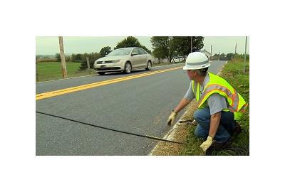 Here's What Those Weird Black Tubes In The Road Are For
