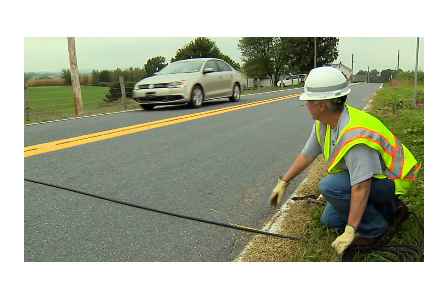 Here's What Those Weird Black Tubes In The Road Are For